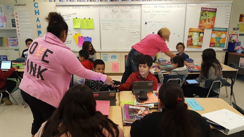 Warm Hearts, Warm Hands distributes hats and mittens to students at Dieterich Elementary