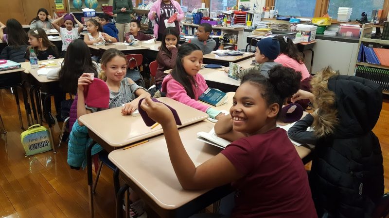 Warm Hearts, Warm Hands distributes hats and mittens to students at Dieterich Elementary