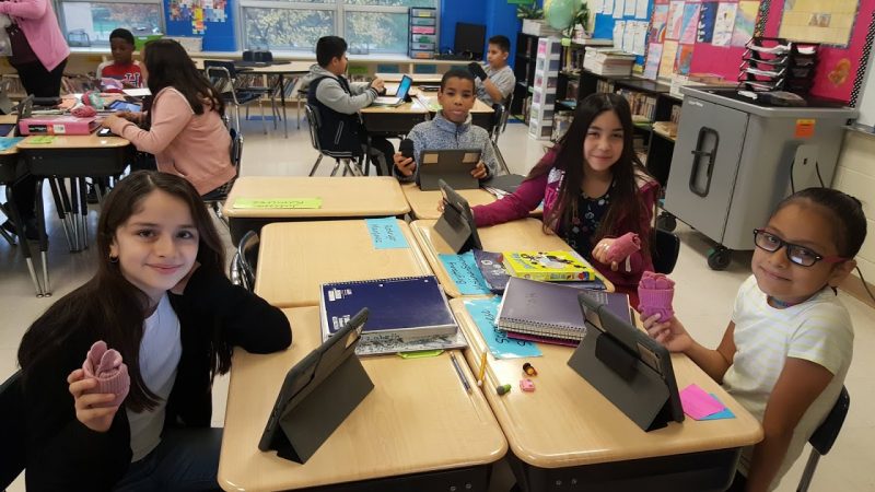Warm Hearts, Warm Hands distributes hats and mittens to students at Dieterich Elementary