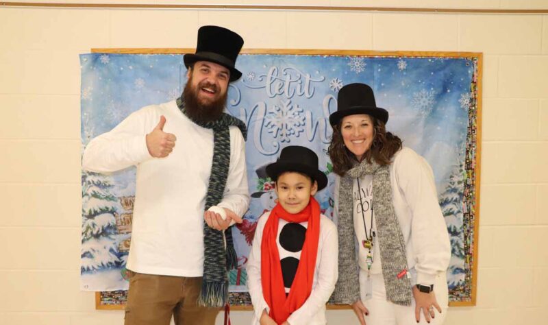 Sophia Zepeta on snowman day with Mr. Savoie and Mrs. Cavanaugh